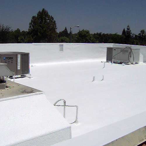 A white roof with air vents and stairs.